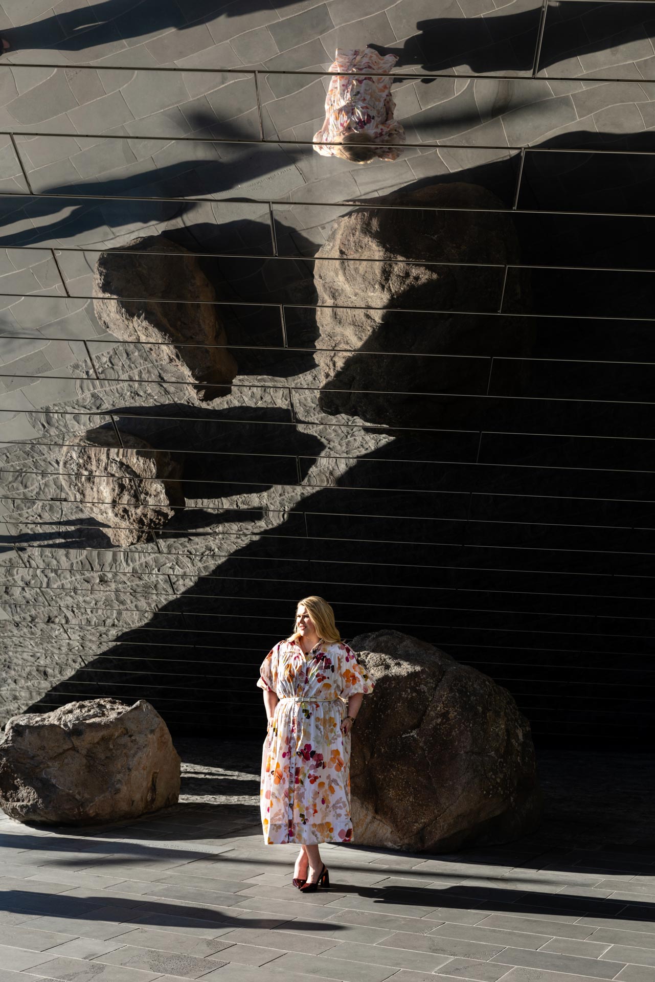 Camille reflected in an architectural mirrored surface