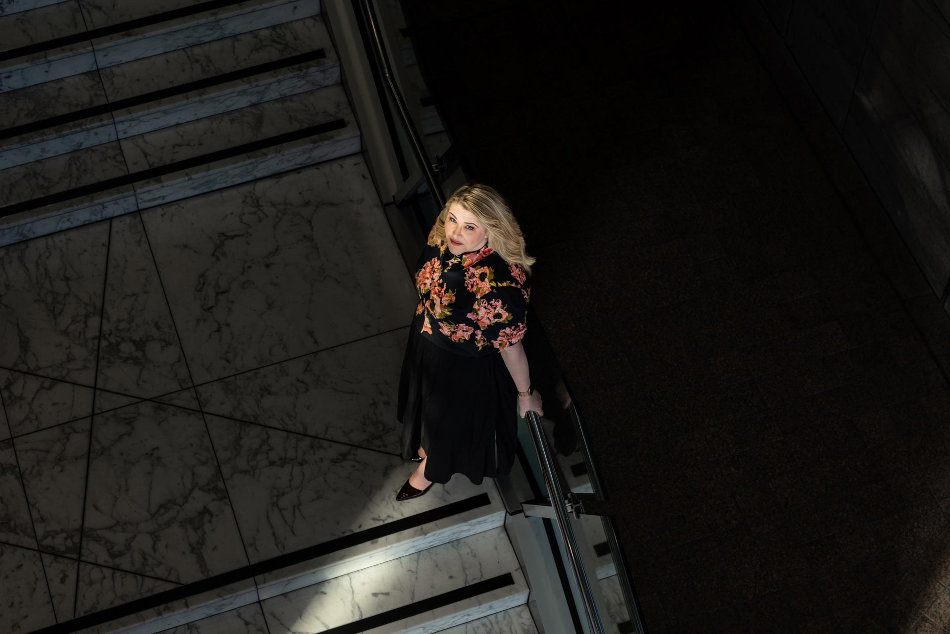 Camille walking down city steps