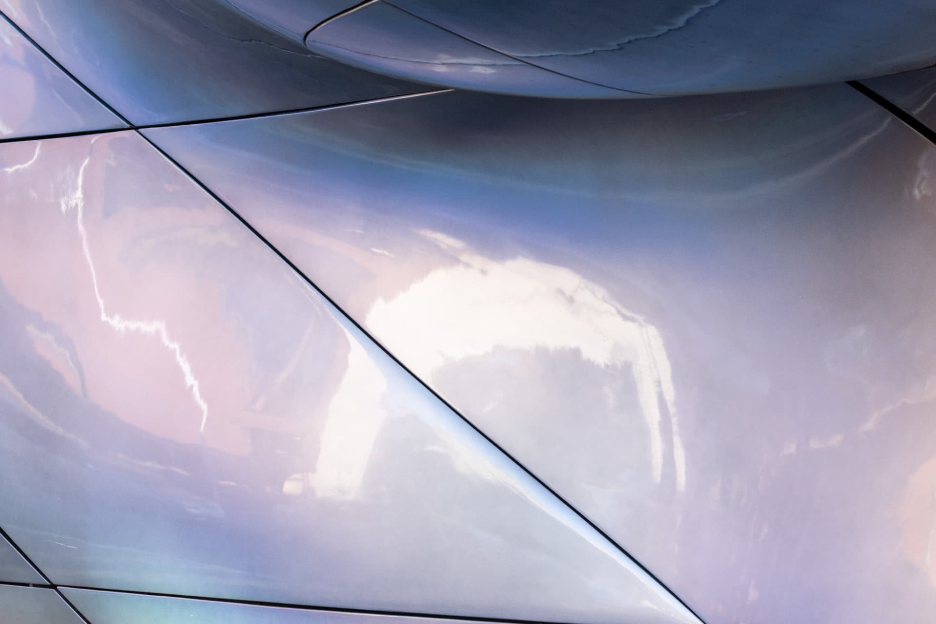 Sky and cloud reflected in iridescent glass
